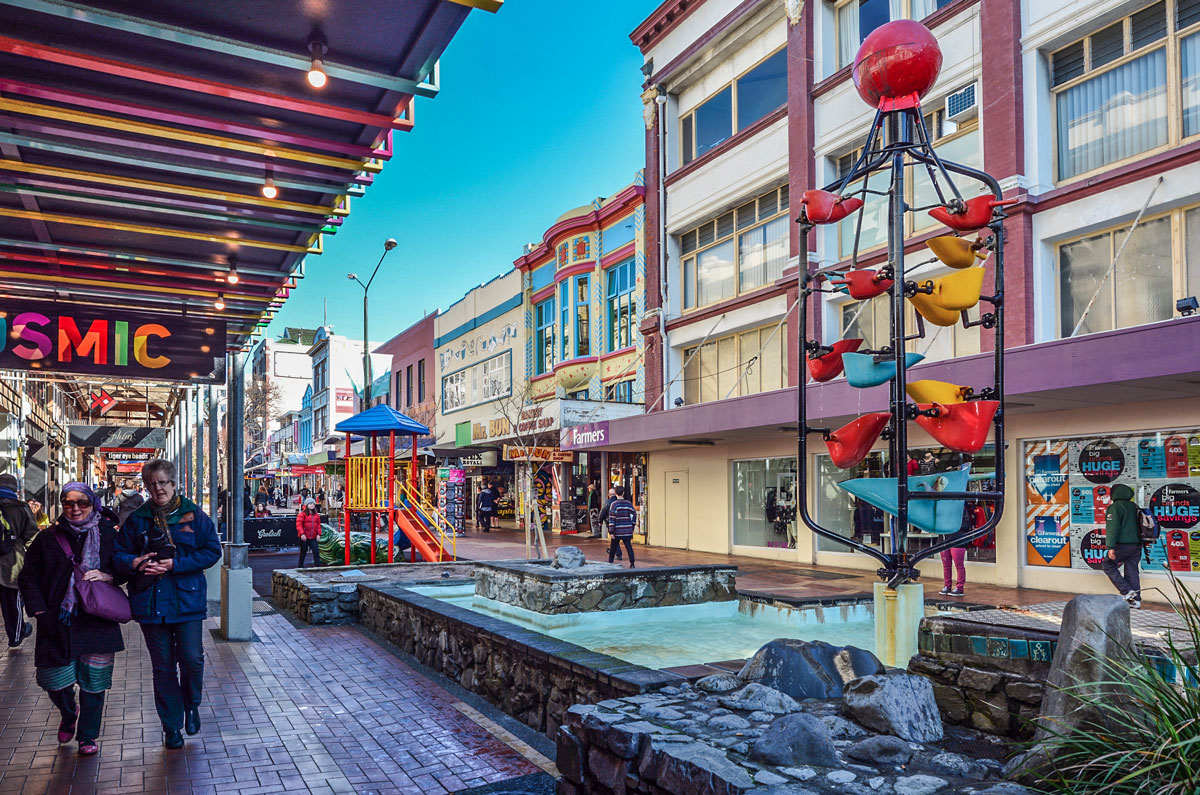 Wellington's Cuba Street โ known for its eclectic cafรฉs, boutiques, and the kind of walkable urban life that attracts creative Americans